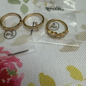 Gold Rings Set with Delicate Charm Minimalist Design and Ornate Stones